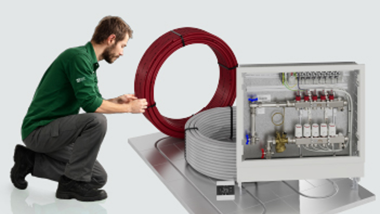 Installer working with underfloor heating